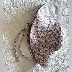 Lack of color floral hat brand new never worn. Accidentally purchased two.